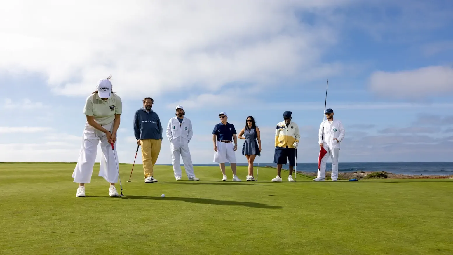 Golfers wearing Malbon Golf apparel on the course